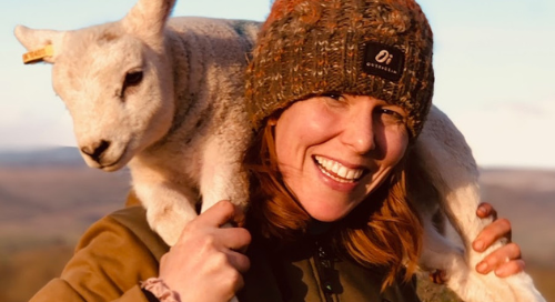 Charlotte Ashley carrying sheep